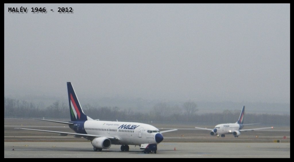 HA-LOB steht am Flughafen Budapest-Ferihegy, daneben kommt HA-LOG an, am 19. 11. 2011. 