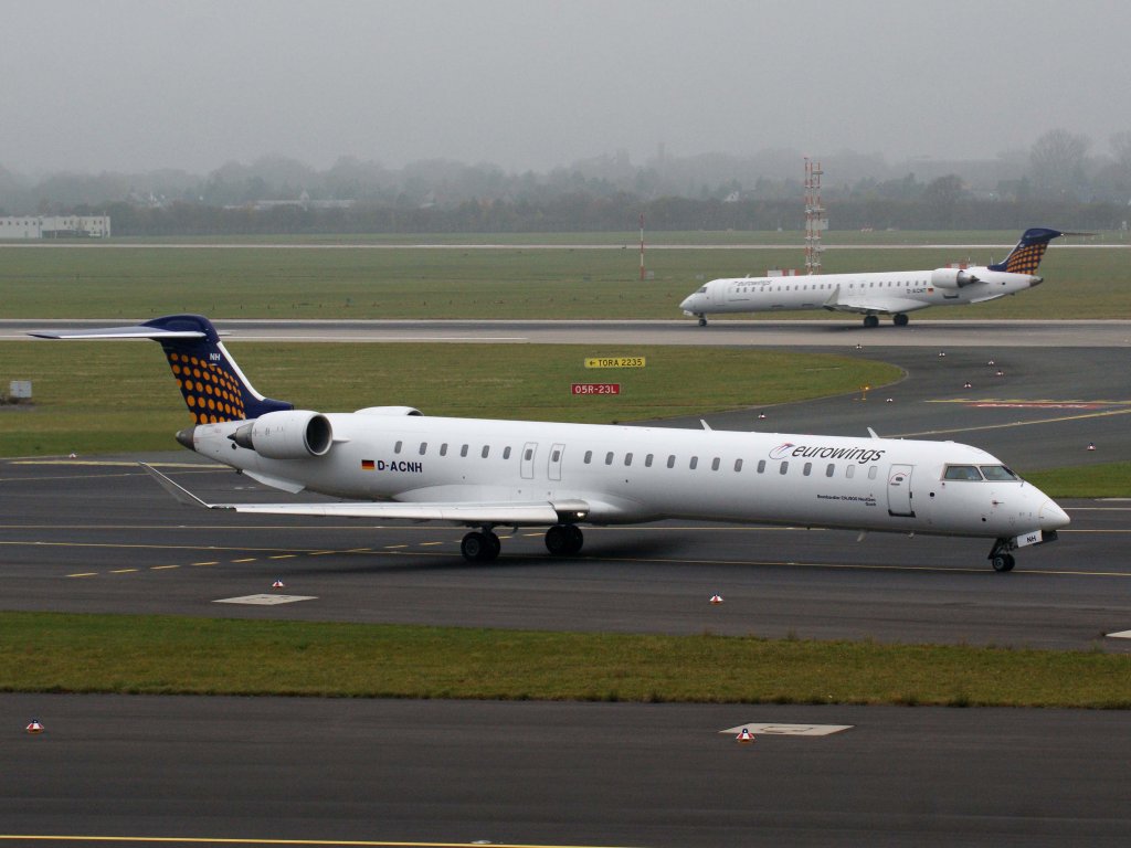 Lufthansa Regional (Eurowings), D-ACNH  Goch , CRJ-900 NG (hinten  D-ACNT  beim Start), 13.11.2011, DUS-EDDL, Dsseldorf, Germany 