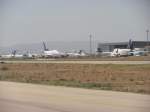 Kurz vor dem Start der Germania Boeing 737-75B von Damaskus nach Aleppo sieht man auf einem Teil des Flughafens den Groteil der SyrianAir Maschinen. Auf Grund des US-Embargos auf Ersatzteilen der Flugzeuge mssen 6x Boeing 727-200/adv, 2x Boeing 747SP und 2x Airbis A320-200 stillgelegt werden. 
Auch zwei Maschinen des Types Tupolev Tu-154M, die wegen Unwirtschaftlichkeit stillgelegt sind, stehen versteckt hinter dem Airbus A320. (Damaskus 15.04.2010)