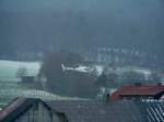 Hubschrauber der Firma Merova auf einen Flug zur berprfung von Freileitungen des regionalen Energieversorgers WAG am 24.11.2008 in der Ortslage von 36100 Petersberg - Marbach bei Schneetreiben