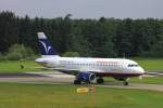 Hamburg Airways aus Mallorca, der Airbus A319 verlsst soeben runway 06 und fhrt Richtung Gate