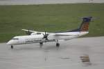 leipzig-halle-lej Eine Bombardier Dash 8 Q400 mit der Kennung D-ADHT der Augsburg Airways/Lufthansa Regional auf dem Vorfeld des Flughafens Leipzig/Halle. Fotografiert am 01.06.2010. 
