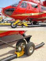 ILA Um Helis mit Kufen am Boden bewegen zu k�nnen werden kleine R�der montiert. Die R�der werden mit zwei Bolzen an den Kufen befestigt. �ber den ca.75cm lange Hebel wird eine Hydraulik bedient. Diese presst die R�der auf die Erde, und die Kufen sind frei. Um den Heli auch in bestimmte Richtungen bewegen zu k�nnen, sind die R�der an den Kufenspitzen beweglich gelagert. Der 'Hydraulic Jack' hebt 5500kg. Foto: ILA 2008, 30.05.2008  