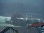 Sonstiges Hubschrauber der Firma Merova auf einen Flug zur �berpr�fung von Freileitungen des regionalen Energieversorgers �WAG am 24.11.2008 in der Ortslage von 36100 Petersberg - Marbach bei Schneetreiben unterwegs