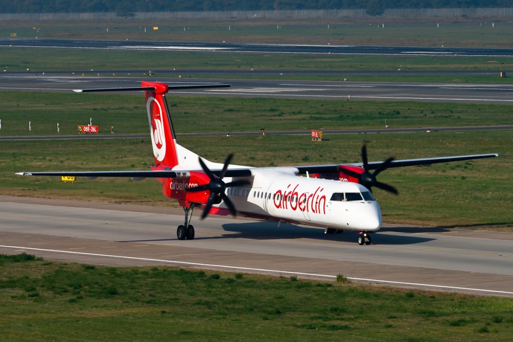Eine Dash8 in Tegel, eines meiner Lieblingsmotive.
