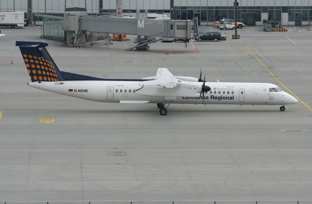 Lufthansa Regional(Augsburg Airways) De Havilland Canada DHC-8-402Q D-ADHE an einem sehr trben 10.03.2011 auf dem Flugafen Mnchen