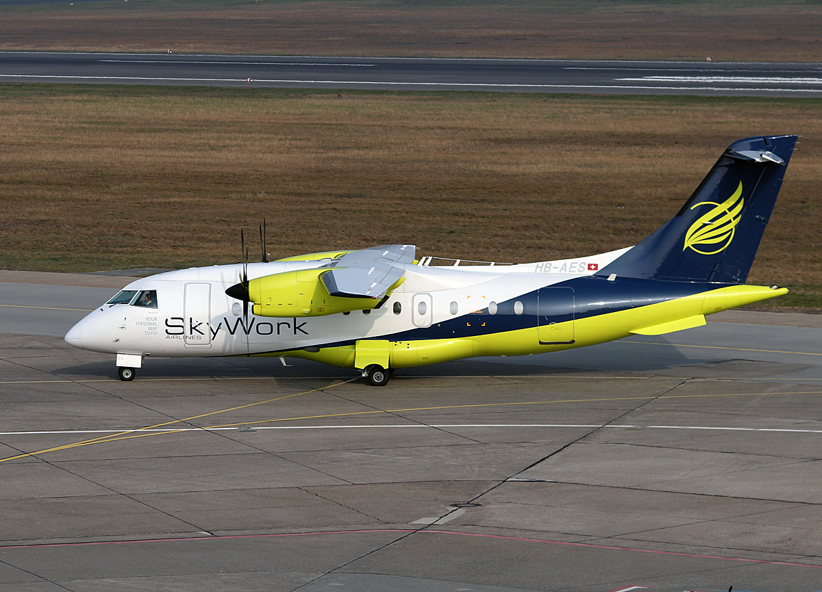 SkyWork Airlines Do-328-10 HB-AES bei der Ankunft in Berlin-Tegel am 29.03.2014