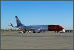 Auf dem Vorfeld des Flughafens Marrakesch-Menara wartet die 737-800 LN-NGL  Johan Frederik 'Frits' Thaulow  der Norwegian Air Shuttle auf die Fluggäste.