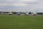 Vier verschiedene Business-Jets von verschiedenen Betreibern auf einem Abstellfeld nahe der Runway in Berlin-Schnefeld (17.08.10)