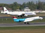 Luxair Embraer ERJ 135R LX-LGK beim Start in Berlin-Tegel am 21.04.2011. Im Hintergrund Spanair A 321-231 EC-INB.
