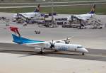 DHC 8-402Q Dash 8 LX-LGA der Luxair auf dem taxyway und 2 B 737 der Lufthansa im Hintergrund - FRA 14.04.2012