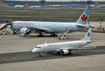ERJ 190-100LR der Air Dolomiti, D-AEMG und B 777 der Air Canada im Hintergrund - FRA 14.04.2012