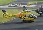 EC 135 P2, D-HHIT des ADAC und Robinson R22 D-HALW der AirLloyd an der Tankstelle in EDKB - 10.01.2023