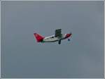 Bei dunkelen Gewitterwolken ist das Sportflugzeug Gippsland GA-8 / LX-MDT vor kurzem vom Flugfeld in Noertringen gestartet, an Bord sind 2 Fallschirmspringer welche sie auf die Absprunghhe bringt. 07.07.2012