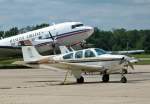 Beech F 33 A, N1849S, dahinter eine DC-3 in Oshkosh 26.07.2014