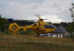 Eurocopter EC 135 der ADAC Luftrettung GmbH,  Christop 10   D-HLDM beim Abheben im Herdorf am 05.08.2011