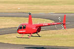 R 44 Raven I D-HEAL hovert von der Tankstelle zur Air Lloyd-Halle in EDKB - 03.04.2025