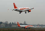 Easyjet Airbus A 319-111, G-EZAO, Easyjet Airbus A 320-214, G-EZOP, TXL, 24.11.2018