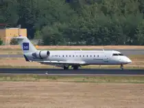 Cimber Air Canadair Regjet CRJ200LR OY-MBT bei der Landung in Berlin-Tegel am 03.07.2010. Hier in Diensten von SAS.
