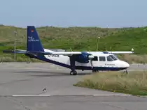 Eine Britten Norman Islander (D-IAEB) der Air Hamburg geniesst am 22.05.2012 die mitt�gliche Ruhe auf dem Flugplatz Helgoland-D�ne